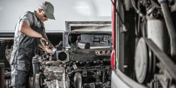 A mechanic changing the O-rings and gaskets in an engine.