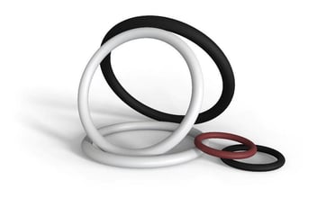 white, black, and brown o rings against white background