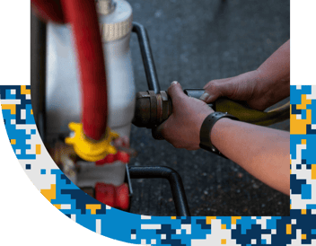 person attaching a hose to a coupling
