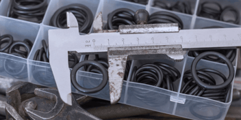 caliper measuring the size of an o ring