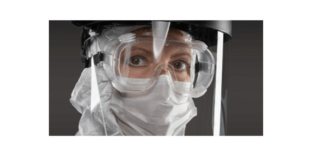 worker with a face shield and mask to protect against covid